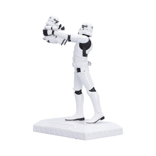 Side view of Original Stormtrooper Who's the Daddy? Star Wars collectible figure of a Stormtrooper holding a small trooper, standing on a white display base.