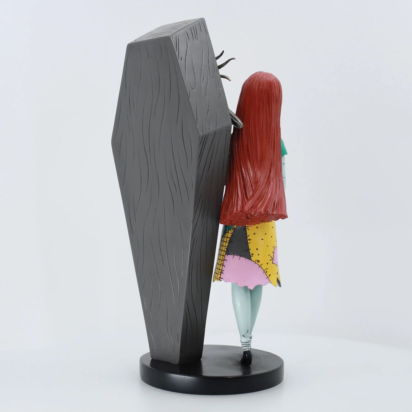 Side view of the Jack Skellington and Sally Coffin Figurine showcasing the Gothic coffin design and detailed cast stone finish.