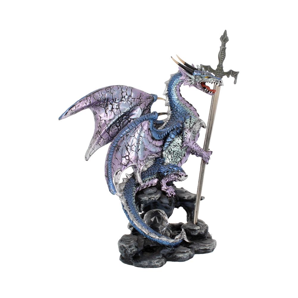 A lilac purple dragon letter opener with a sword, standing on a rock with a small crystal ball next to it on display