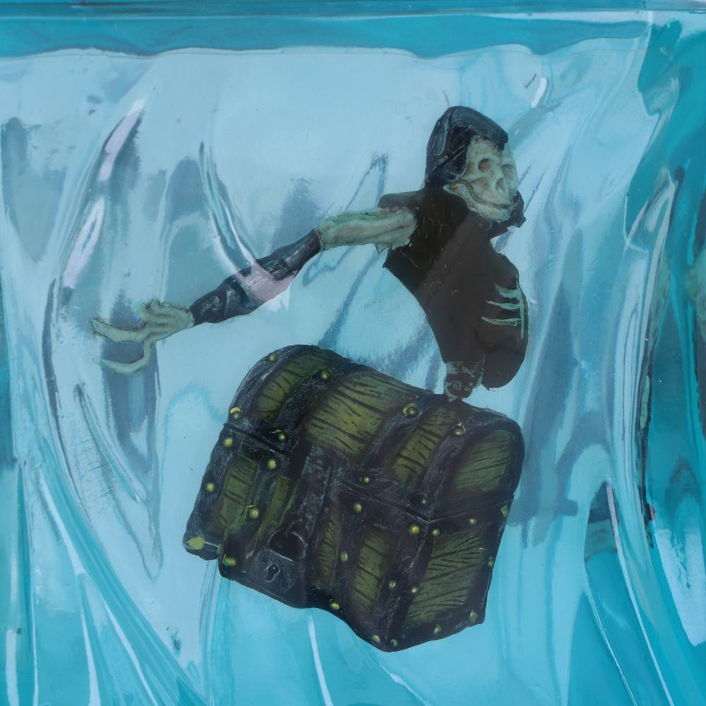 Close-up of trapped adventurer detailing inside cube