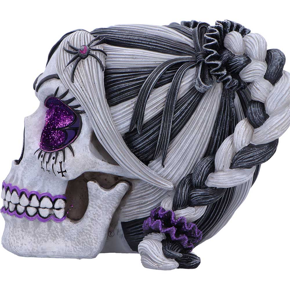 Creepy-cute Drop Dead Gorgeous skull figurine side view