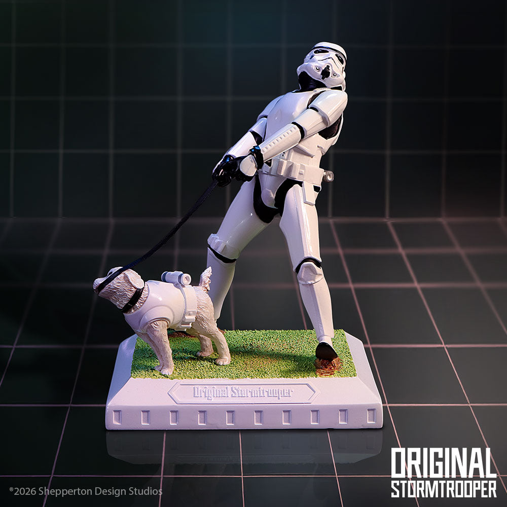Stormtrooper figure with a dog on a grass patch
