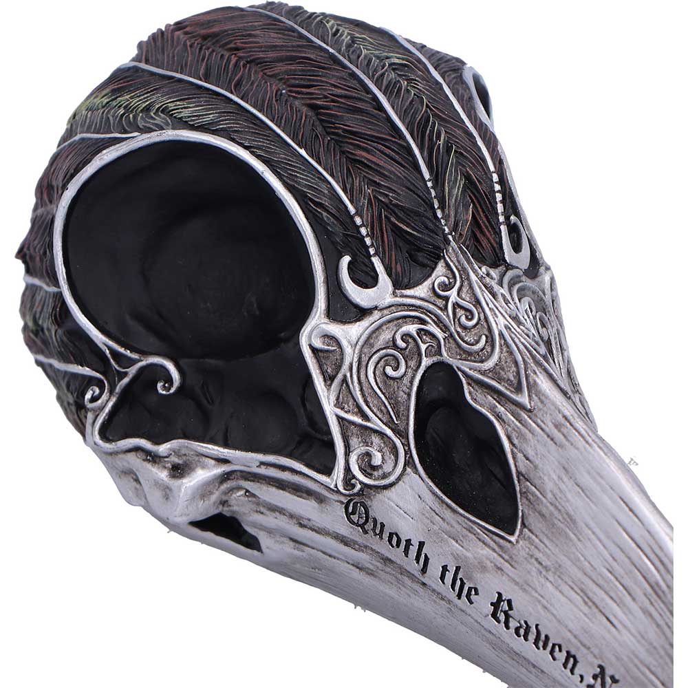 Raven skull ornament close-up showing hand-painted details