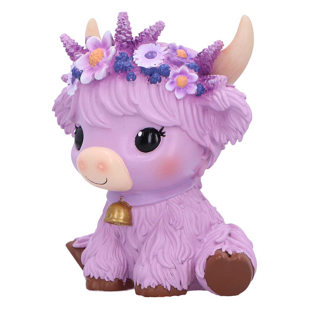 Purple cow figurine with flowers
