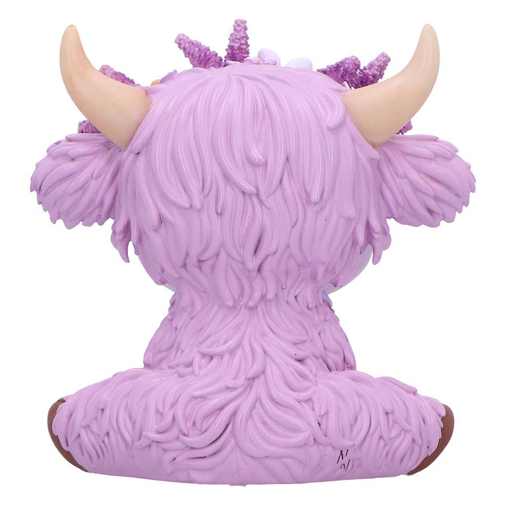 Purple cow figurine with horns and a fluffy texture