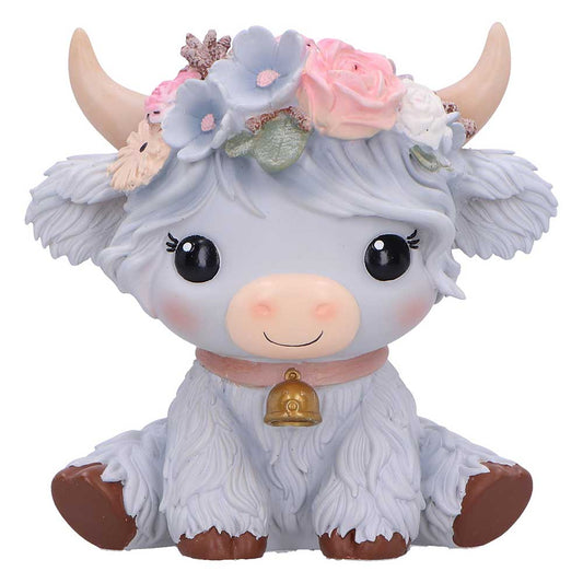 Cute figurine of a cow with floral crown and bell
