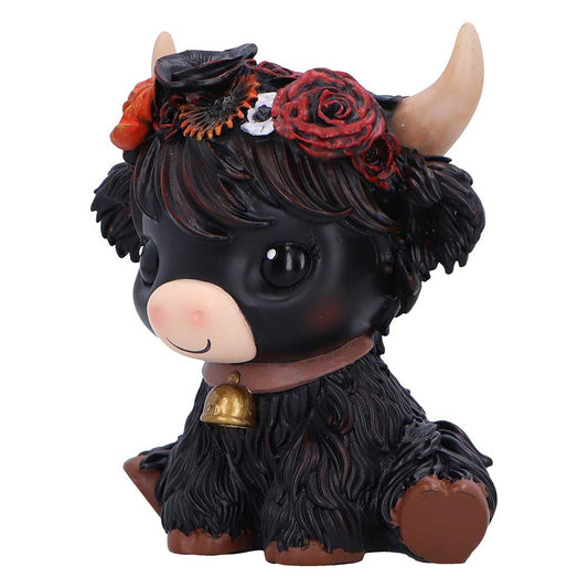 Black cow figurine with flowers