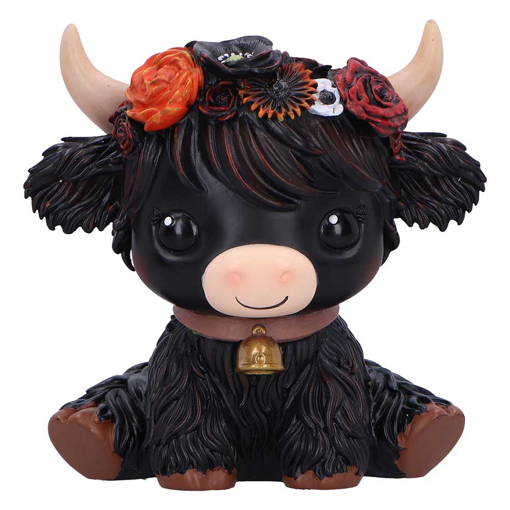 Black cow figurine with floral headband