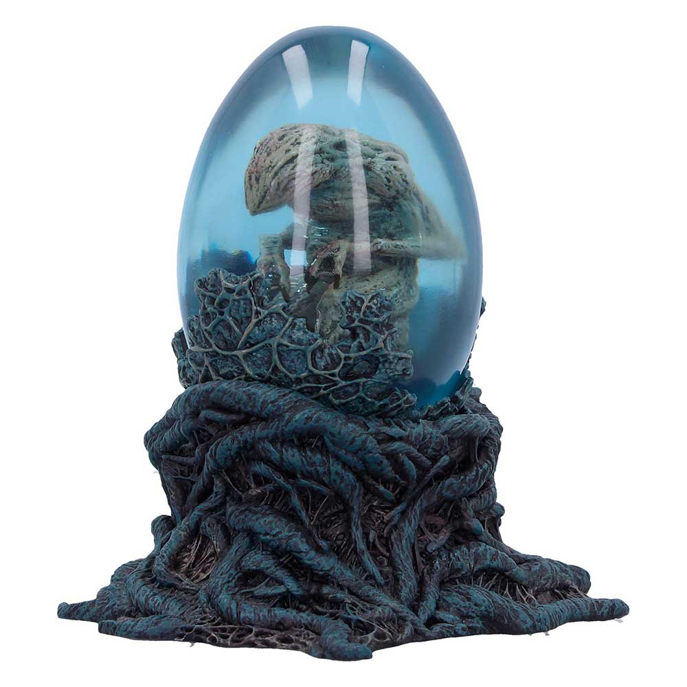Demodog figure inside glass egg with blue liquid effect