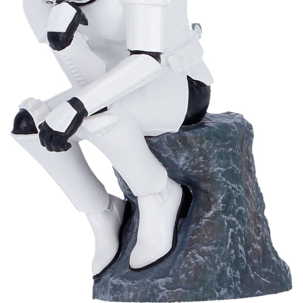 Stormtrooper figurine sitting on a rock