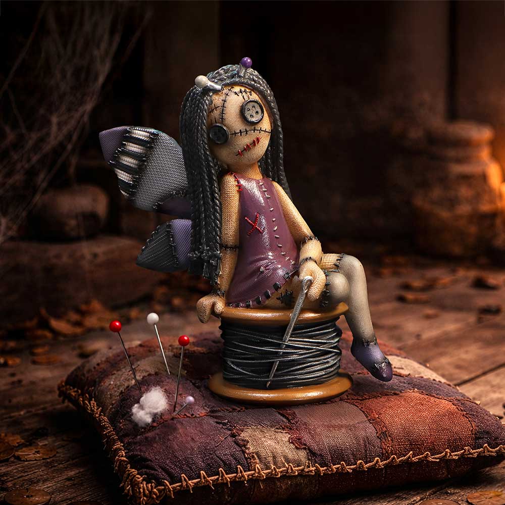 Hand-painted gothic Stitchlings figurine design on display