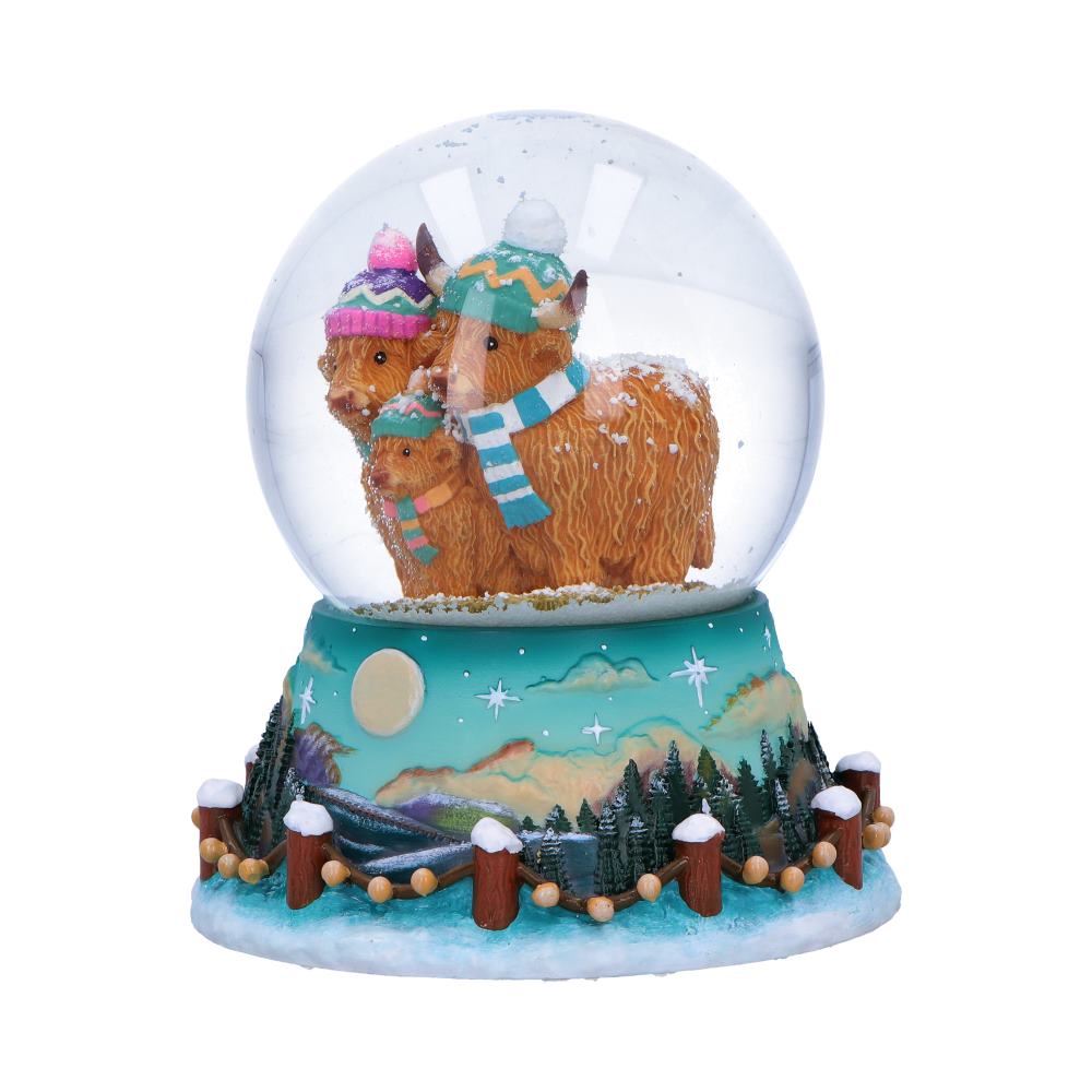 Side view of Highland cow family snow globe