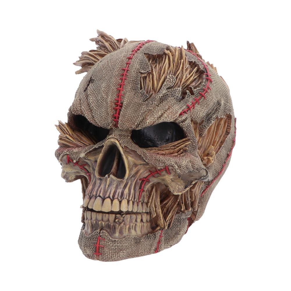 Side view of Keeper of the Harvest Skull with fabric texture and red stitching
