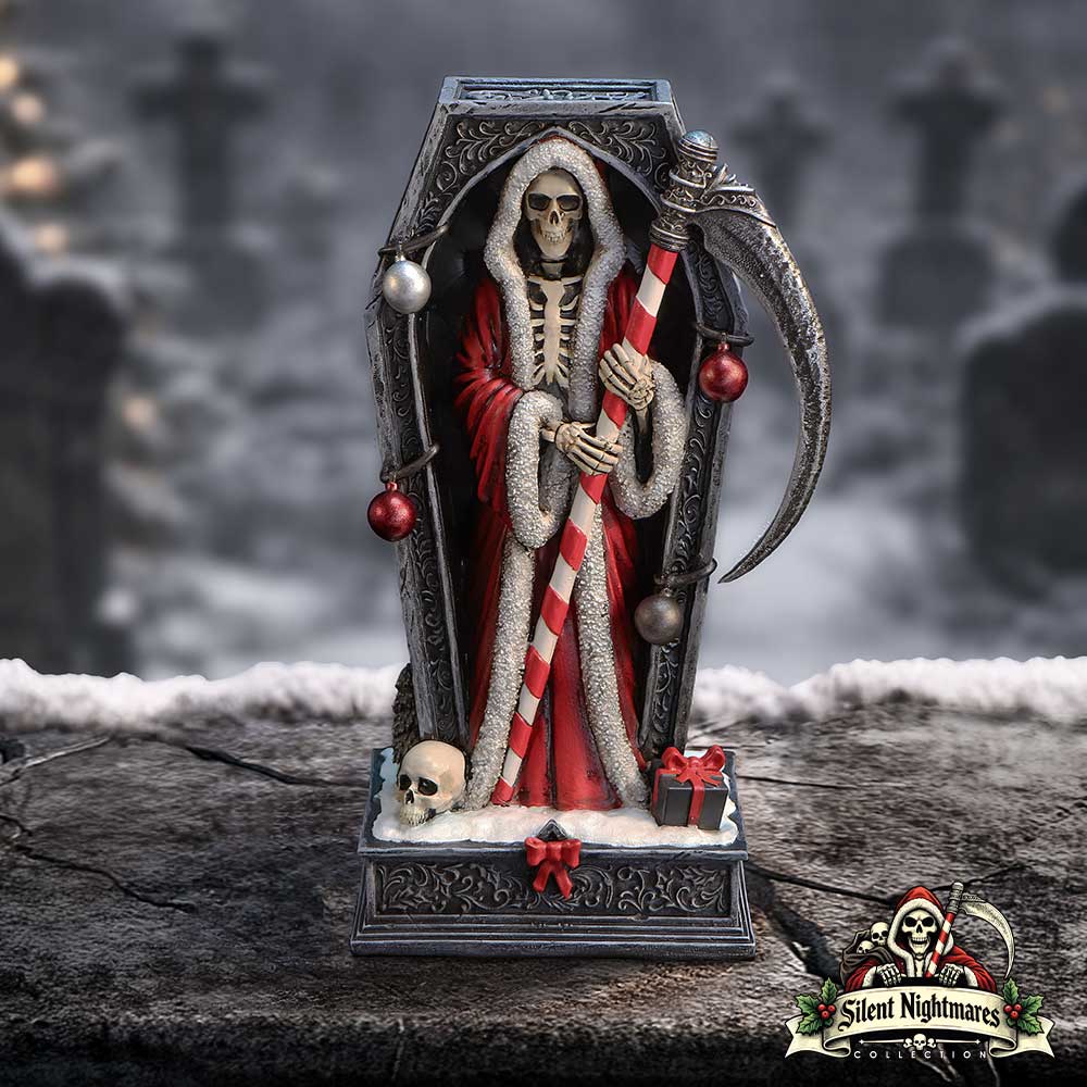 Decorative figure of a skeleton in a red robe with a scythe on display