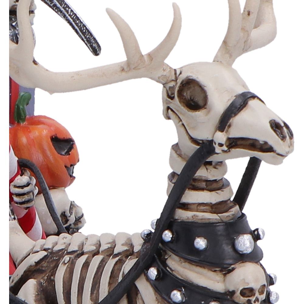 Skeleton reindeer Christmas figure with a pumpkin and candy cane 