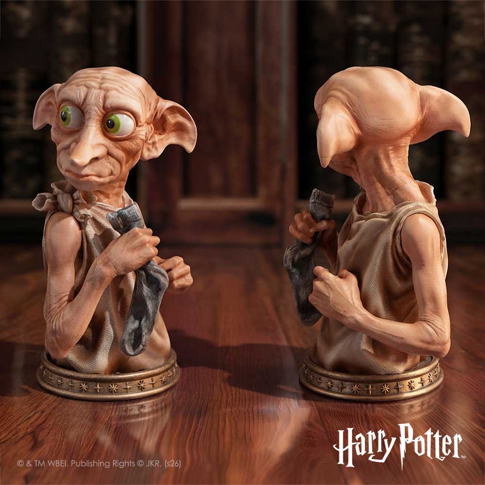 A collectible bust figurine of Dobby the house-elf from Harry Potter, featuring detailed sculpting of his wrinkled skin, large yellow eyes, and pointed ears, holding a gray socks, set on a decorative bronze base