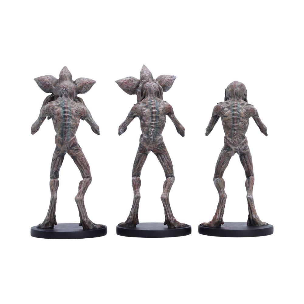 Rear view of the Stranger Things Three Wise Demogorgons figurine set showing the detailed sculpting and hand-painted designs.