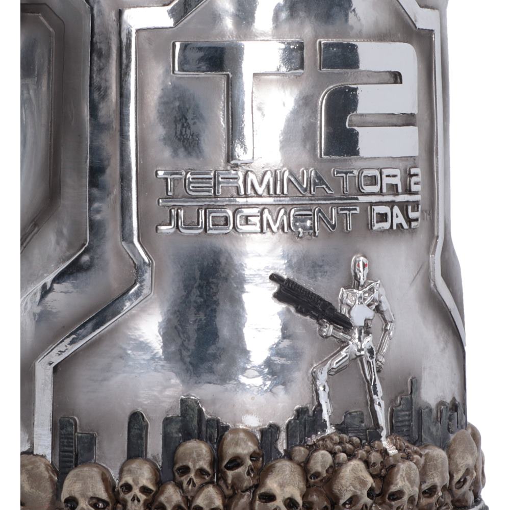 Terminator 2 Judgment Day collectible Tankard featuring a silver T-800 endoskeleton, a pile of skulls at the bottom, and embossed 'T2 TERMINATOR 2 JUDGMENT DAY' text on a metallic background.