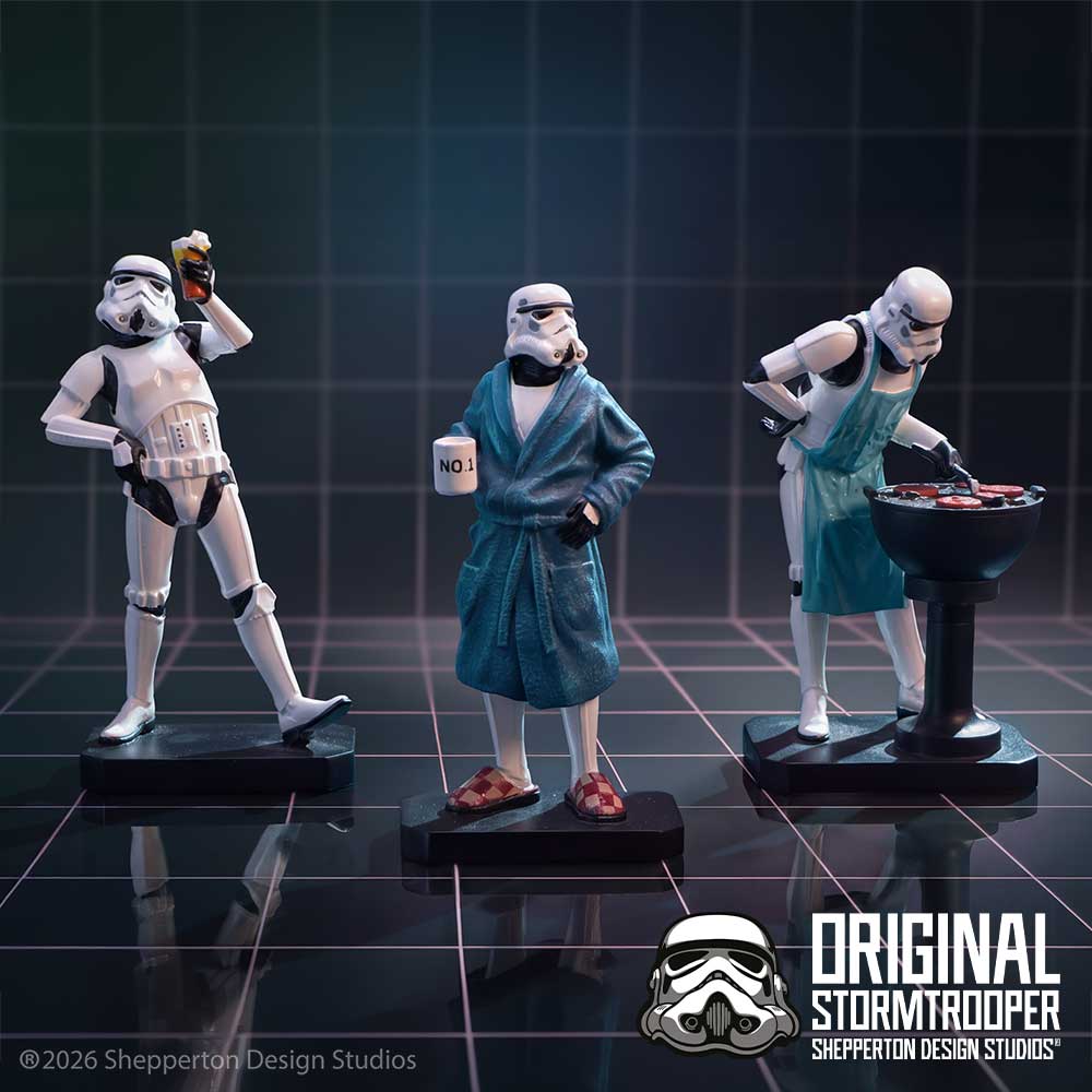 Three hand-painted Star Wars Stormtrooper Living for the Weekend collectible figurine set on display: one holding a drink, one in a robe holding a mug that says 'NO!', and one cooking burgers at a barbecue.