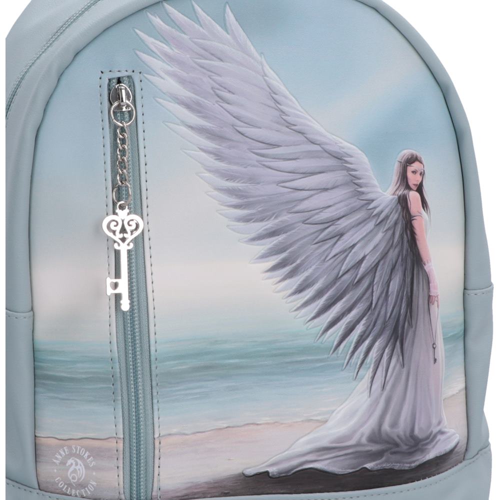 A light blue backpack featuring female angel with large white wings standing on a beach, with a silver key hanging from the front zipper on Spirit Guide Anne Stokes backpack .