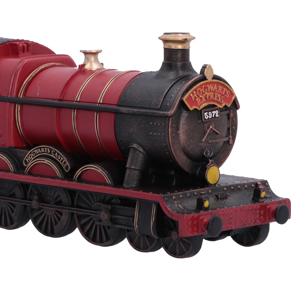 Close-up of detailed Hogwarts Express locomotive collectible box features a dark black front cab and red body with gold accents and lettering.
