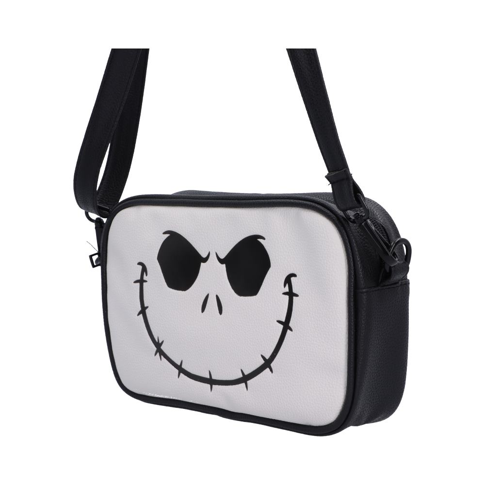 Side view of Jack Skellington Nightmare Before Christmas bag, a black and white crossbody bag featuring a stylized Jack Skellington face printed on the front.