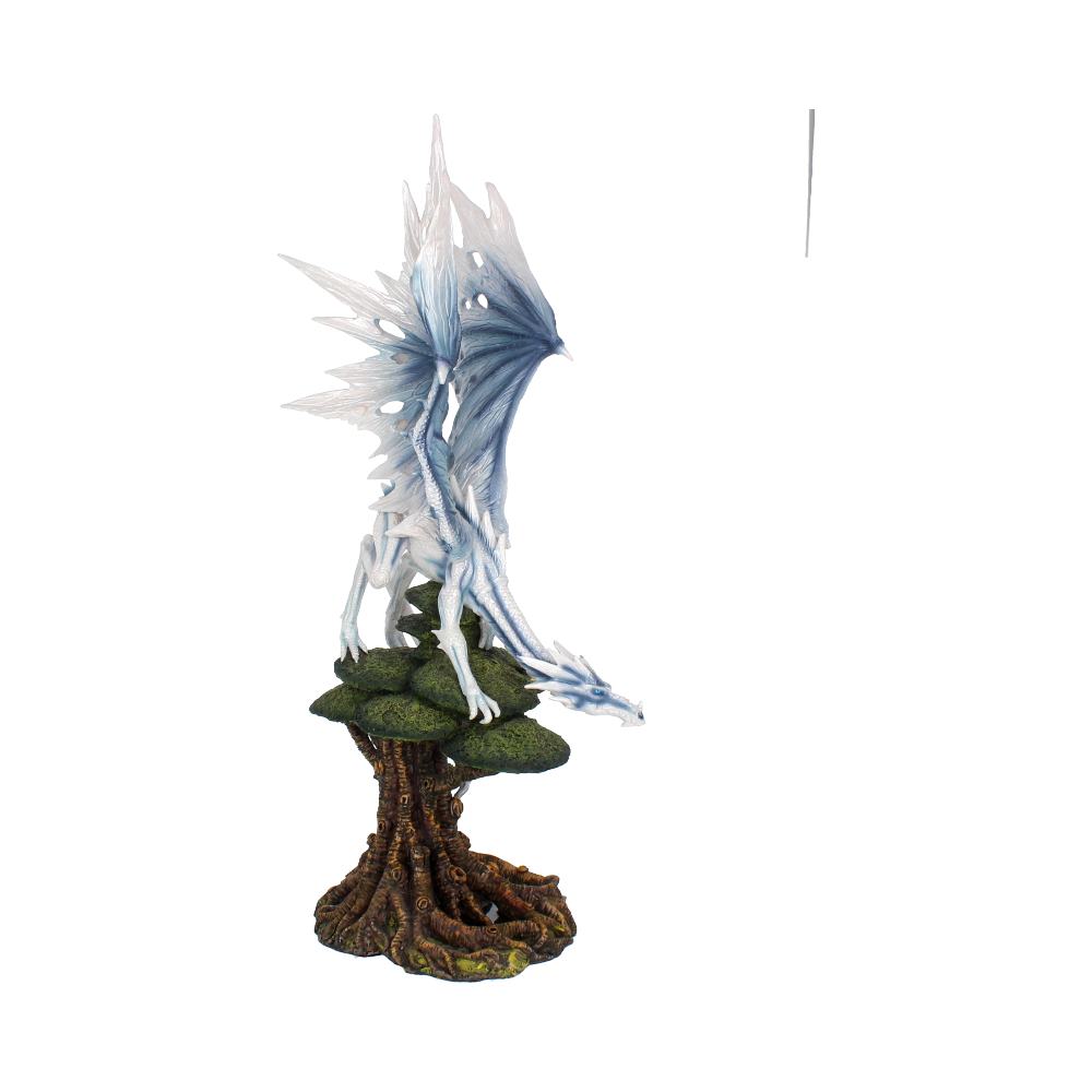 Fantasy Dragon perched on ancient tree 