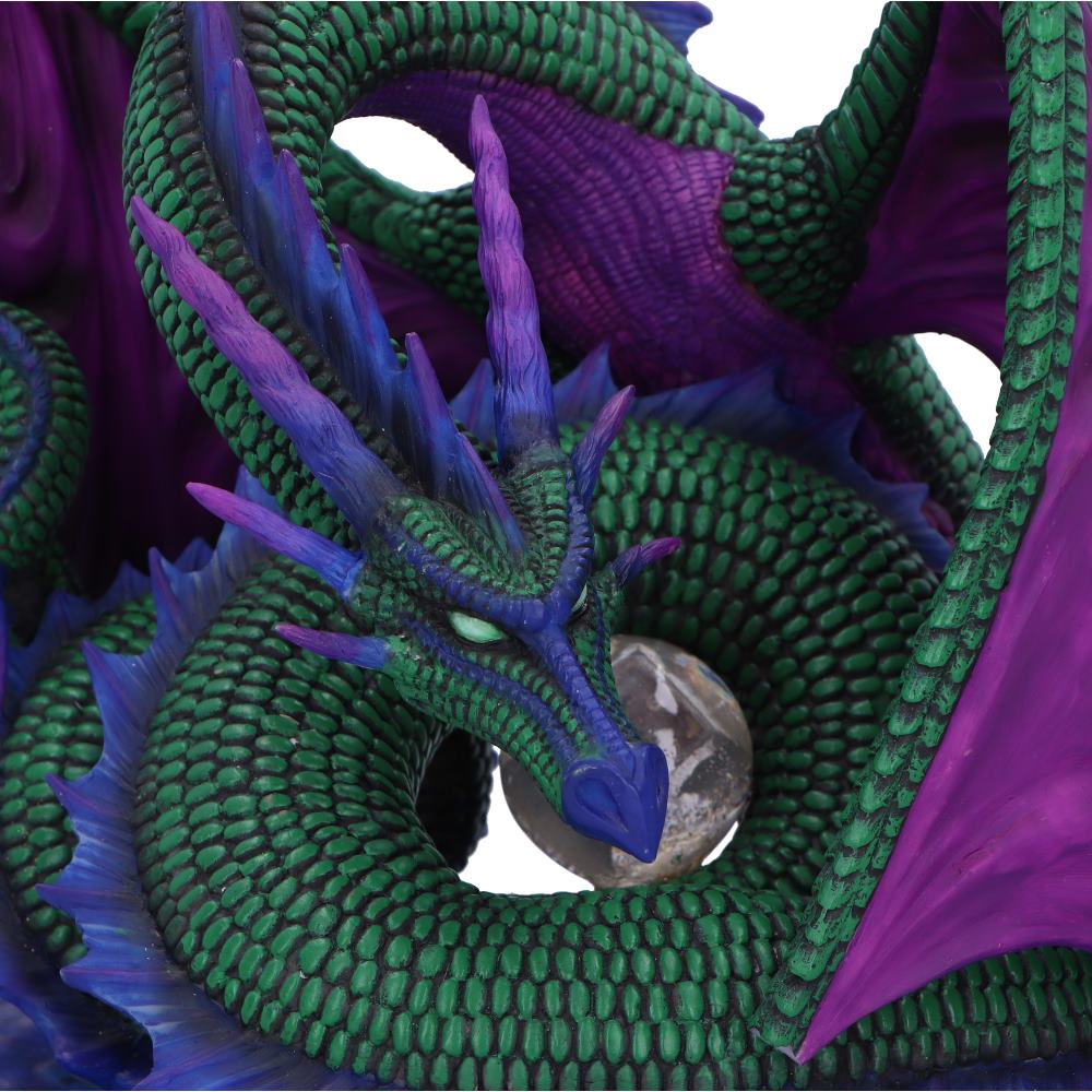 Fantasy dragon holding gemstone