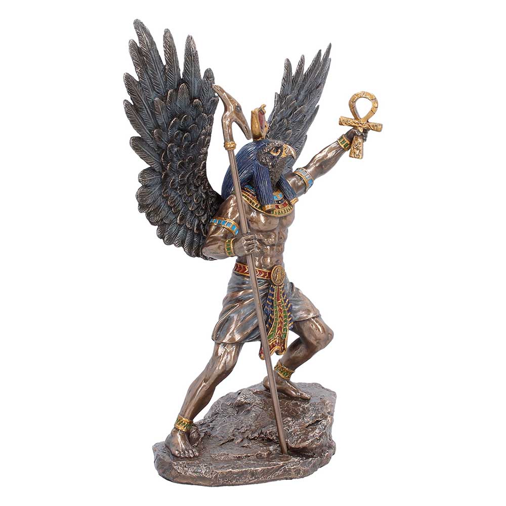 Ancient Egyptian Ra figurine with wings and staff detail
