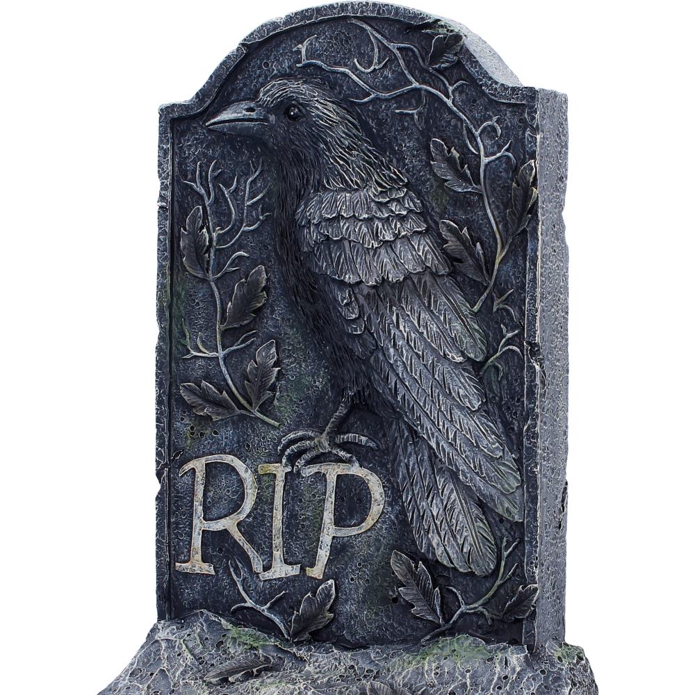Close-up of raven and RIP engraving detail
