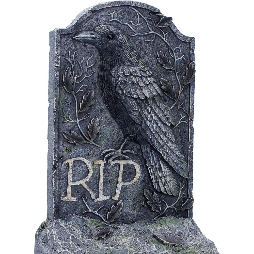 Gothic-style gravestone with a crow and 'RIP' inscription