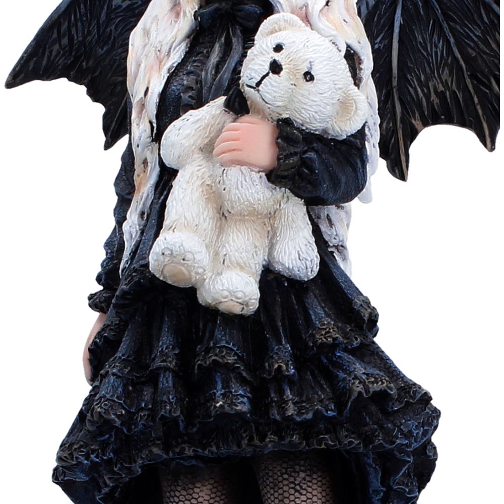 Gothic fairy figure with black wings and dark dress holding a white teddy bear.
