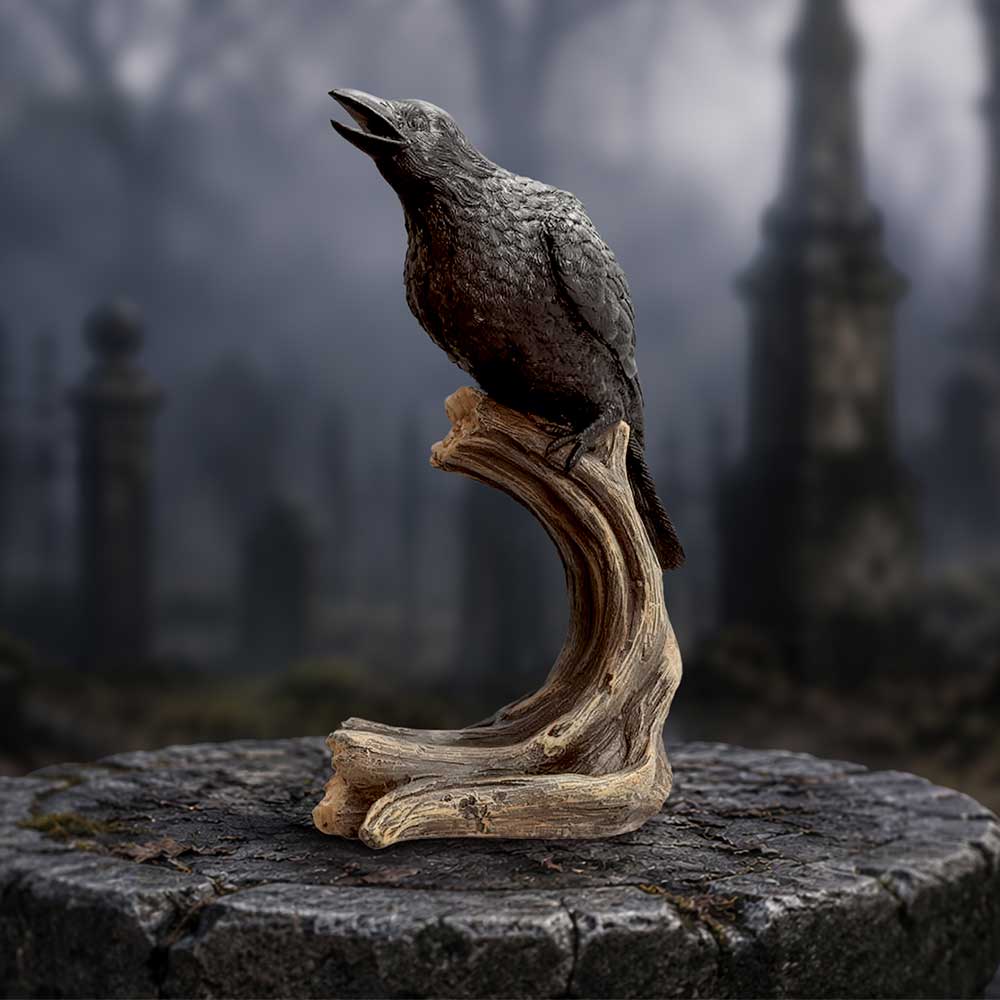 Raven’s Caw black raven displayed on a realistic wooden branch
