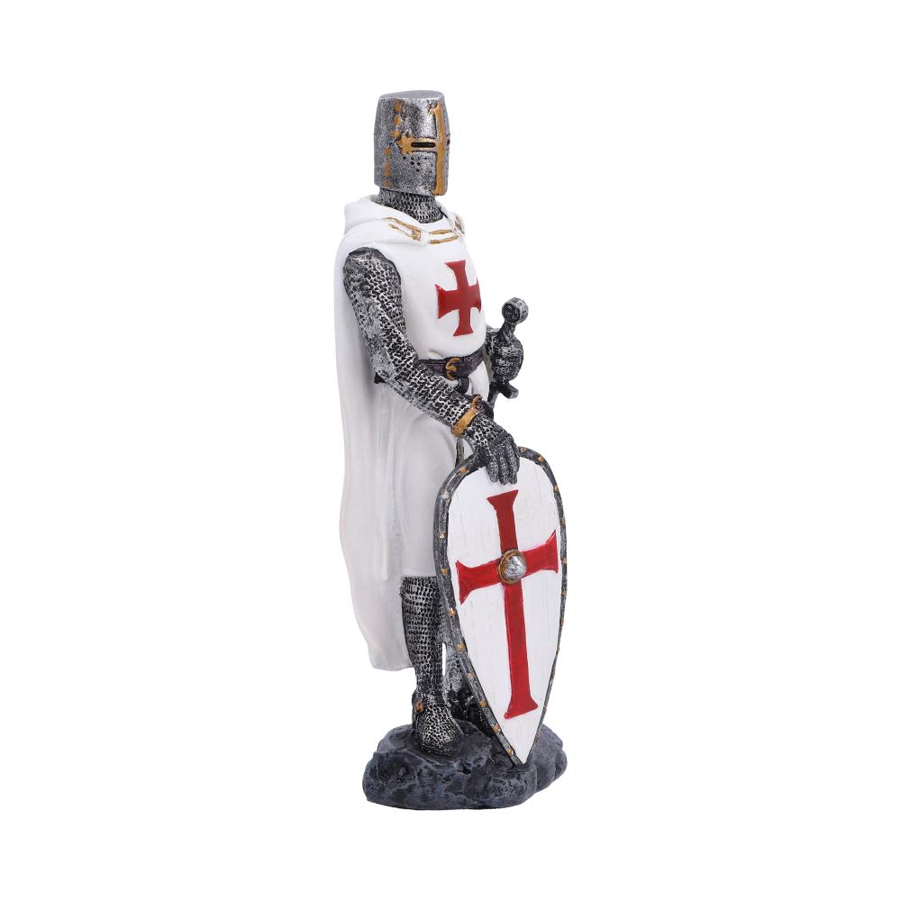 A medieval crusader knight figurine standing on a dark base, wearing silver chainmail armor and a white cape with a red cross, holding a matching shield with a red cross.