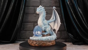 360° view of Safira the Protector LED Dragon Figurine showcasing the illuminated dragon egg, frosted ice dragon detailing, premium resin craftsmanship, and hand-painted finish.