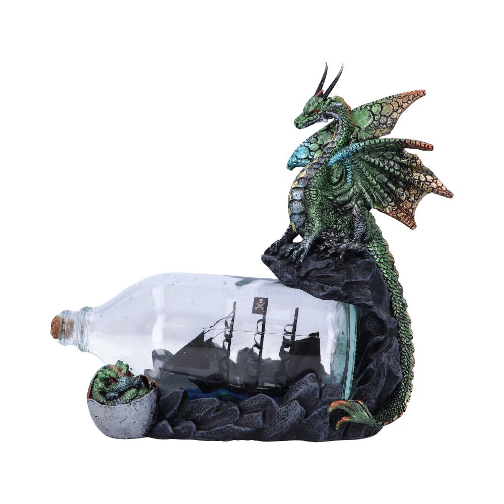 The Adventure Dragon Figurine 22cm featuring a green dragon perched on a rocky cliff overlooking a pirate ship inside a glass bottle with a dragon hatchling emerging from its egg.