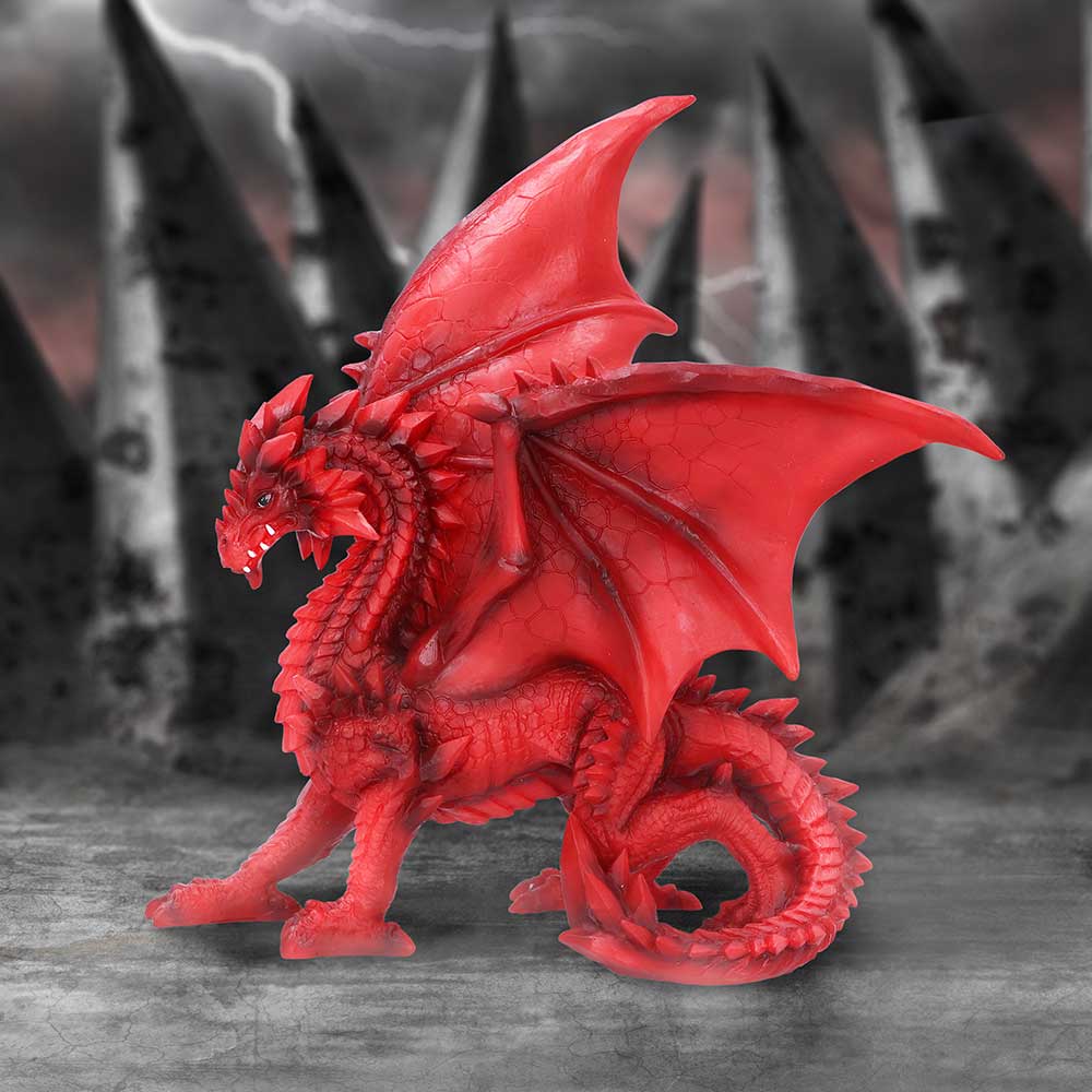 A red dragon figurine with detailed wings and spiked tail, standing in a dynamic pose on disply