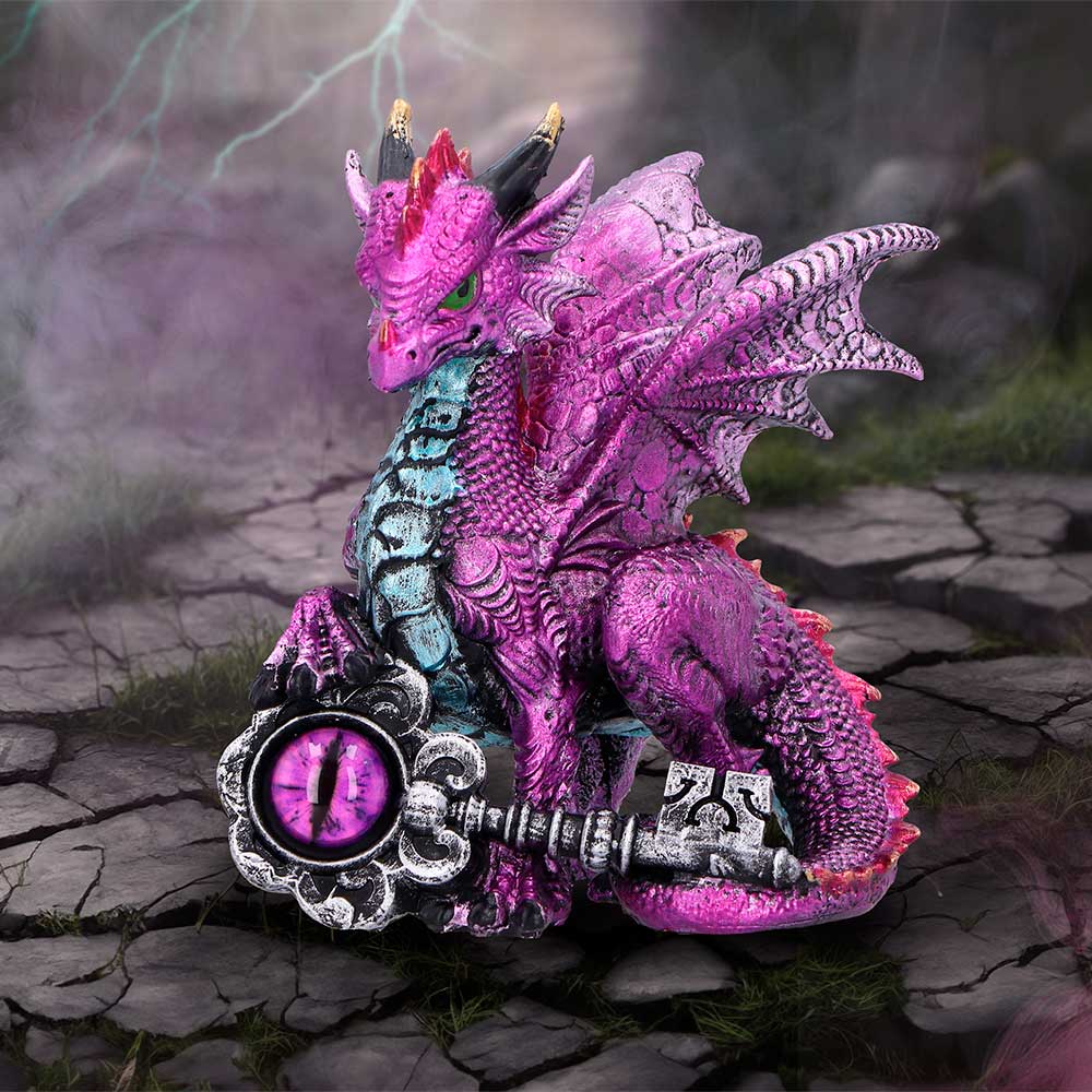 A figurine of a purple dragon with silver wings and a silver key, with metallic purple and pink paint details on display