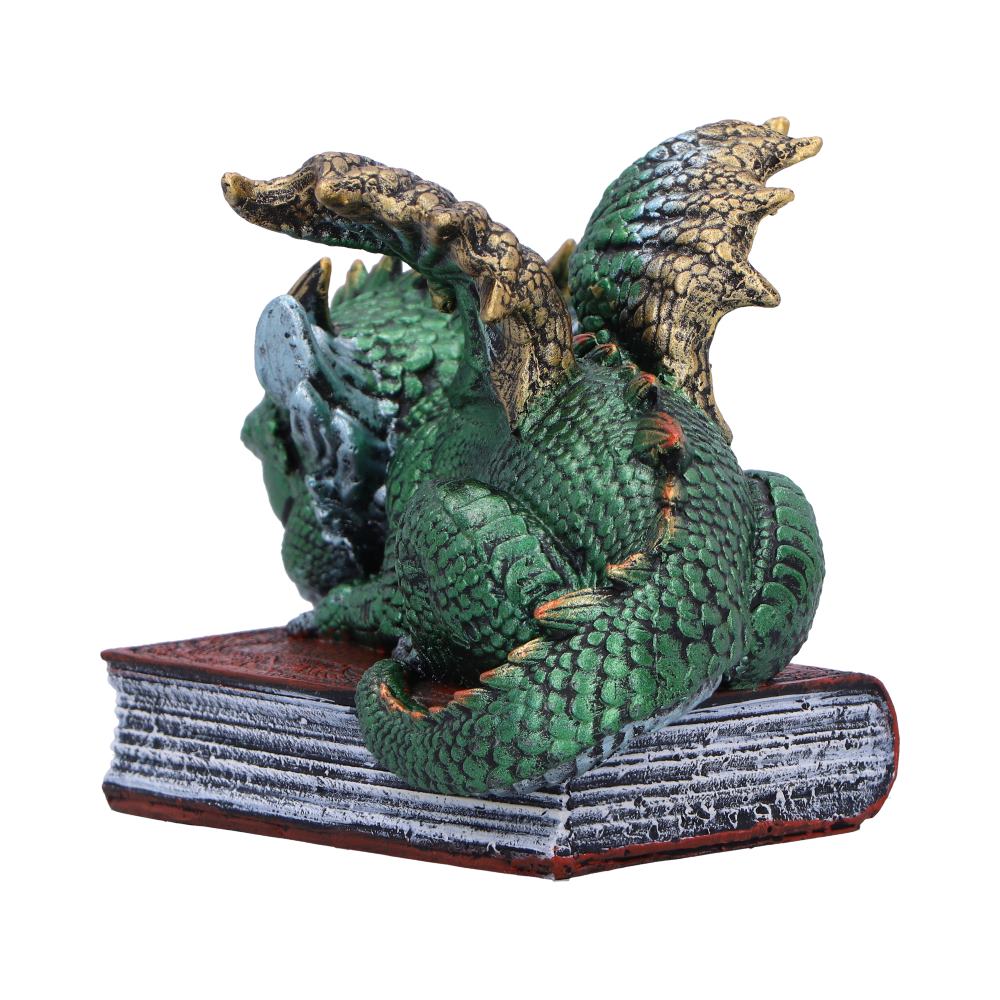 Back view of the Where Dragons Dream figurine showing the sleeping dragon, textured spellbook, detailed wings, and hand-painted resin finish.