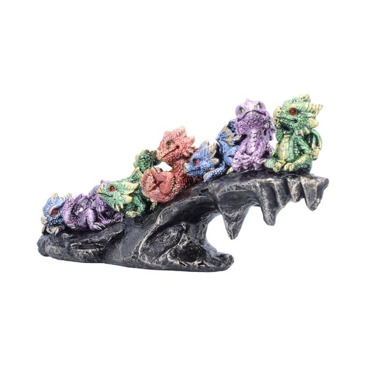 Colourful baby dragons figurine on rocky base