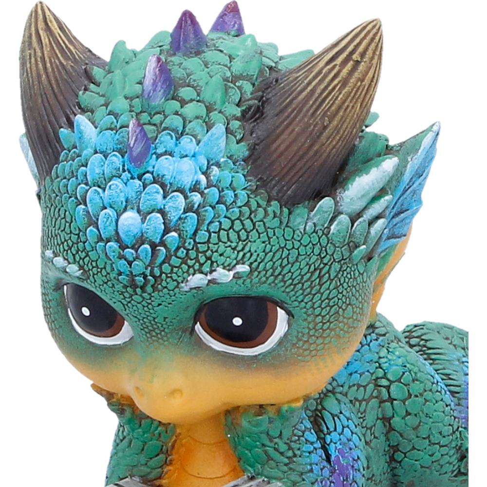 Close-up of Kindle dragon face and book detail