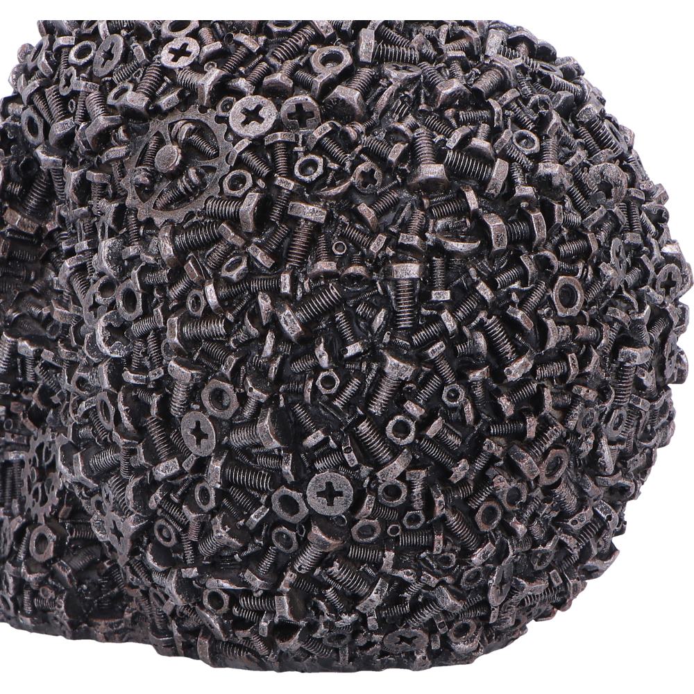 Close up of back view of screwed skull figurine 