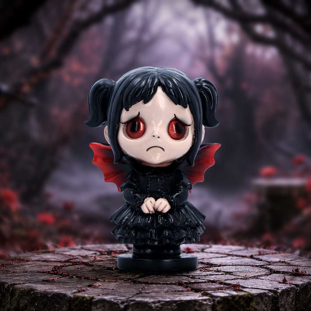 Spirit Fairy Mortina gothic-style figurine with black hair in pigtails, red eyes, and red wings, standing on a black base displayed as a gothic fairy collectible