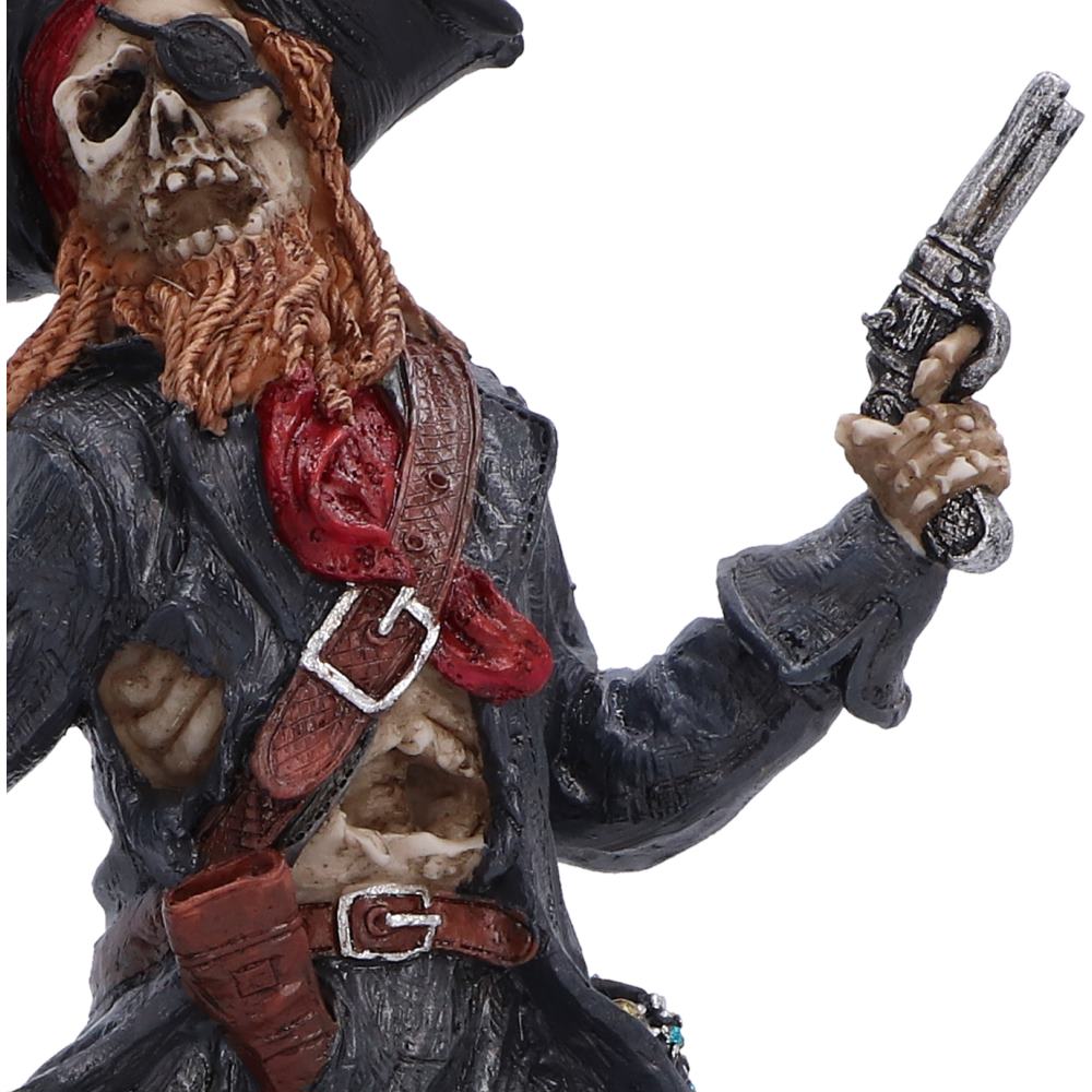 Close-up of the gun held by the Phantom Pirate King figurine with a skull face, black hat, red bandana, brown beard, and black coat, holding a silver revolver