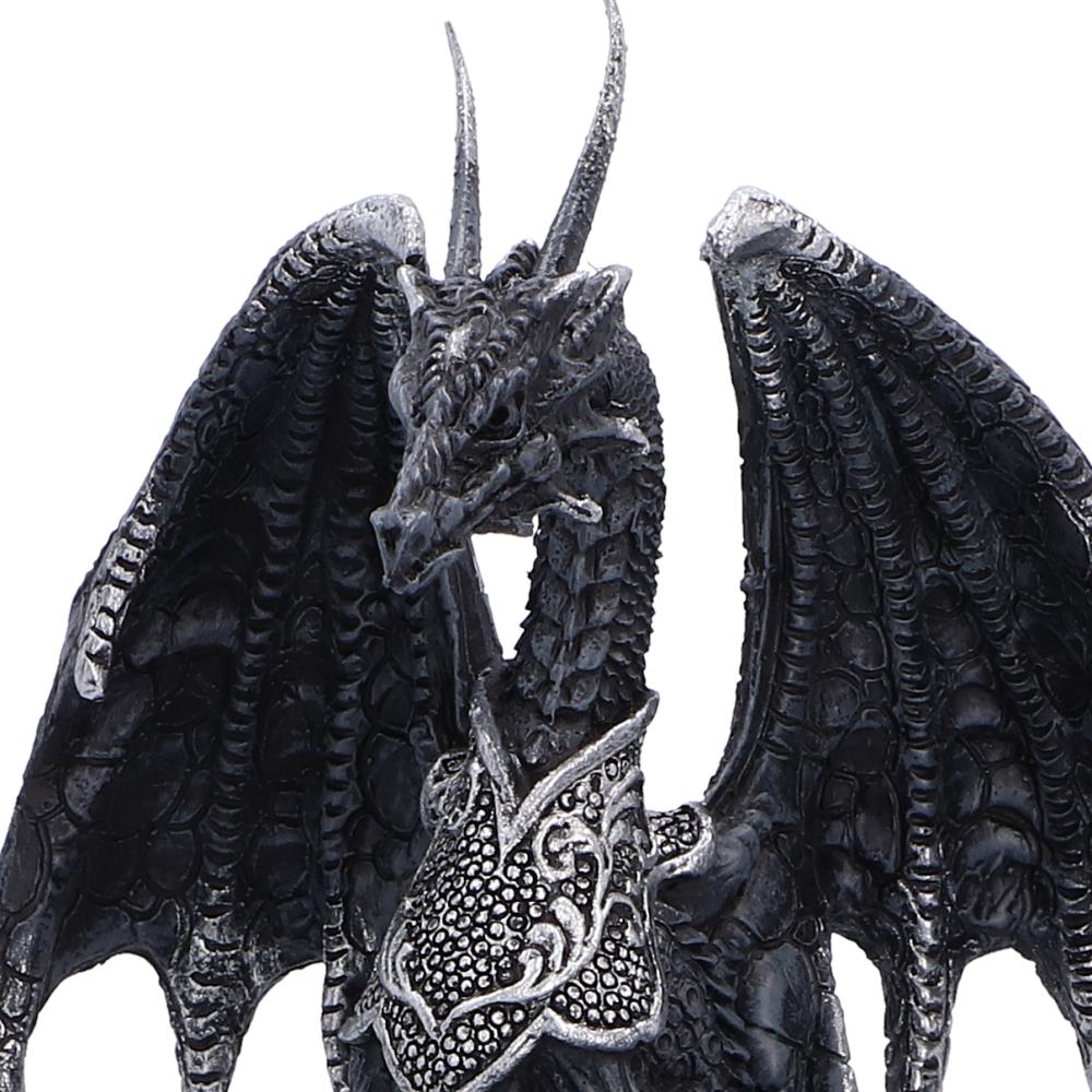 Close-up of the black and silver dragon perched above the snow globe