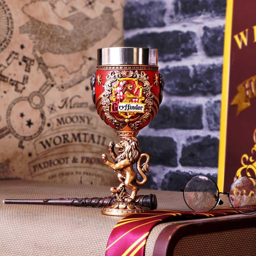 A Gryffindor Hogwarts house collectible goblet featuring the house colors and crest, with a lion design, officially licensed by Harry Potter on display