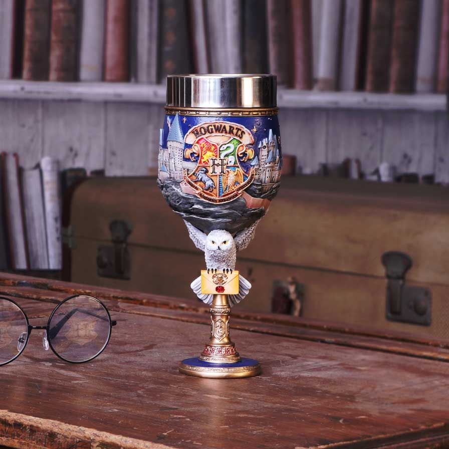 Harry Potter themed collectible goblet featuring Hogwarts crest, a landscape of Hogwarts castle, and an owl with a letter on the stem on diaplay